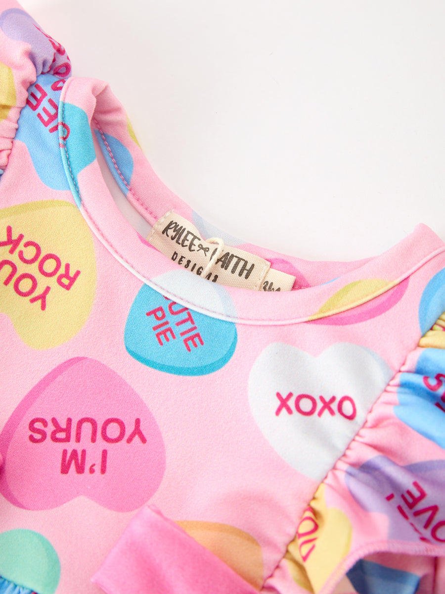Valentine’s Day Girls Conversation Heart Print Bow Romper