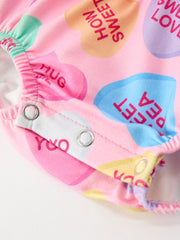 Valentine’s Day Girls Conversation Heart Print Bow Romper